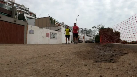 View from the floor of two friends running Video stock 195128907