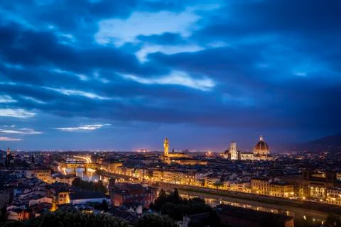 View of Florence during sunset showing the River Arno, Ponte Vecchio, the Pal Stock Photos