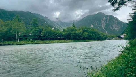 View of flowing river and mountains in the background. Stock Footage 293363672