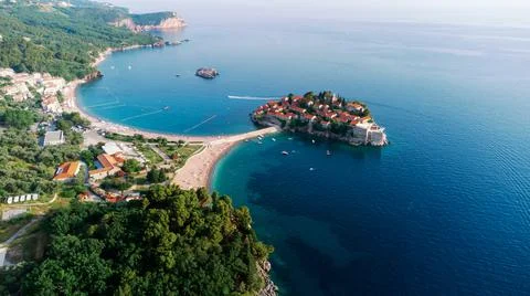 View from flying drone. Panoramic view of Sveti Stefan island in a beautiful  Stock Photos