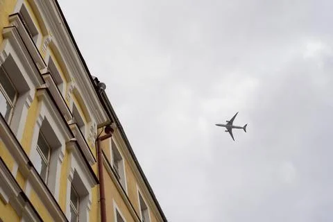 View to flying plane from below Stock Photos