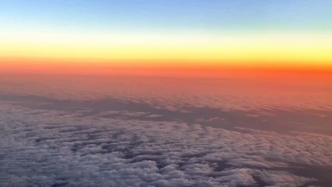 View from a flying plane of clouds and mountains over the Swiss Alps Stockbeeldmateriaal 114804319
