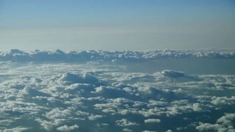 View from a flying plane to the clouds. Beautiful landscape in the sky. Stock Footage 164108239