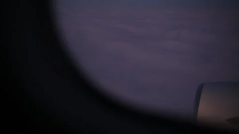 View from flying plane at dark night sky with white fluffy clouds. Stock Footage 135120981