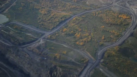 A view from a flying plane to a quarry in the ground. open pit coal mining Stock Footage 140352685
