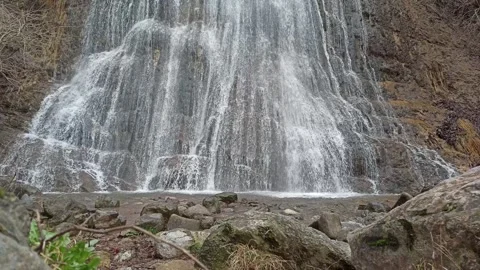 View at the foot of a waterfall Video stock 266733730