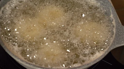 View footage of frying in boiling hot oil Stock Footage 128059513