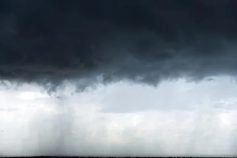 View footage of rain clouds over sea ocean Black clouds in bad weather day. n Stock Photos