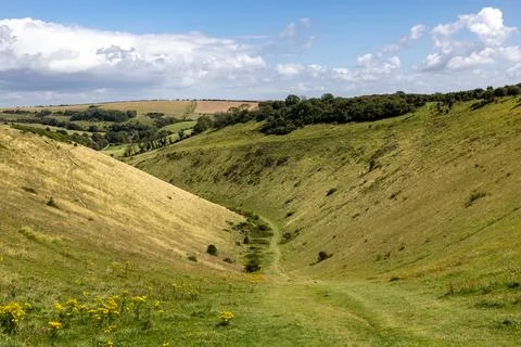A view of the footpath at the bottom of Devil's Dyke in Sussex, on a sunny .. Stock Photos