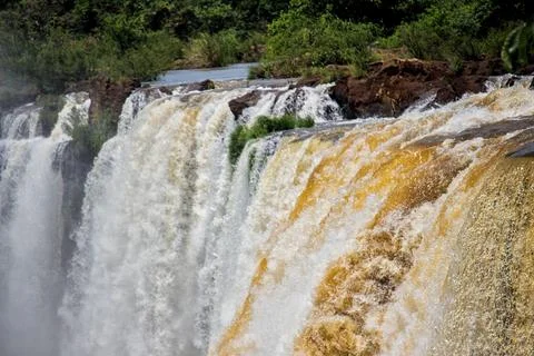View of the force of the water at the edge of a waterfall at Iguazu Falls, .. Stock Photos