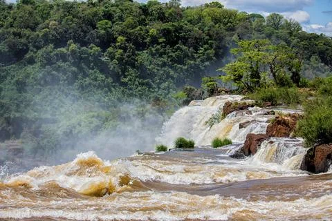 View of the force of the water at the edge of a waterfall at Iguazu Falls, .. Stock Photos