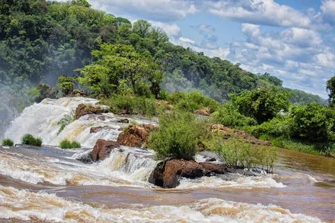 View of the force of the water at the edge of a waterfall at Iguazu Falls, .. Stock Photos