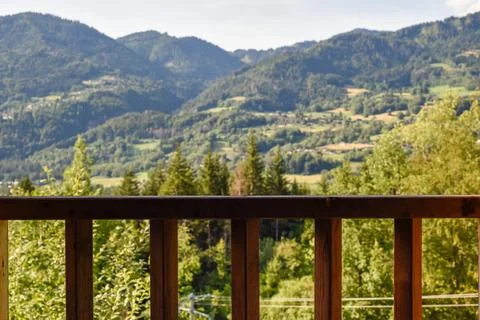 View of a forest on the mountains through a window Stock Photos