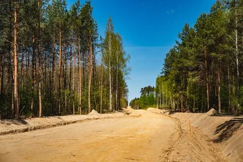 A view of the forest with a new road under construction Stock Photos
