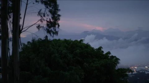 View of forest overlooking a city at night, Guatemala Stock Footage 63056175