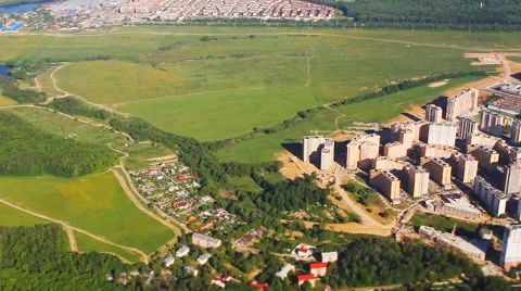 View of forests and settlements with flying airplane Stock Footage 52888503