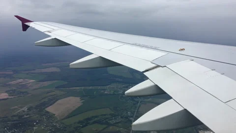 The view form inside of an airplane while approaching for landing at the airport Stock Footage 118726607
