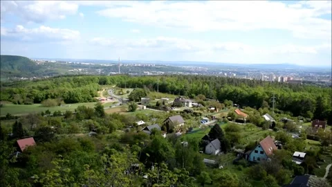 View from forrest small town rock blue sky europe czech republic Stock Footage 134567006