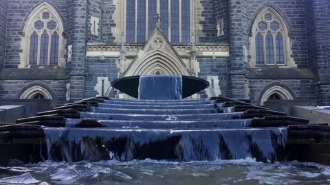View of a fountain in front of St. Patrick church in Melbourne Stock Footage 73281131