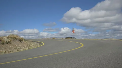 View of four men longboarding with speed in the curves of Transalpina Stock Footage 57789402