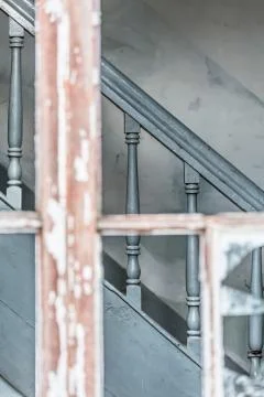 View on frame window of vintage gray wooden staircase Stock Photos