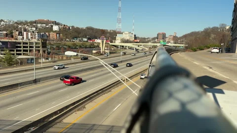 A view of the freeway with a guard rail in the forground. Stock Footage 256950733