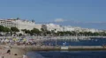 View French Riviera People Sunbathe Sunbathing Swimming Beach Umbrella Cannes HD Footage