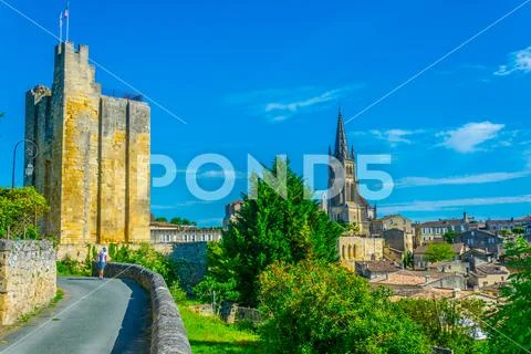 View of French village Saint Emilion dominated by spire of the monolithic chu Stock Photos