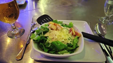 View of fresh Caesar salad with crispy croutons and grated cheese served Stock Footage 332018017