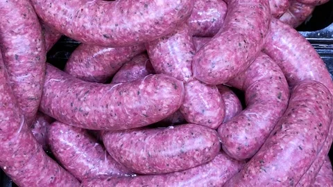 View of freshly prepared minced meat sausages with spices in a natural casing. Stock Footage 166160585