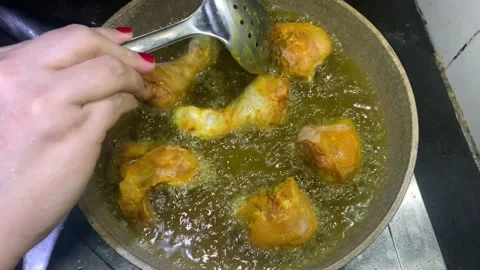 View of fried chicken being cooked in a pan, Stock Footage 285834664