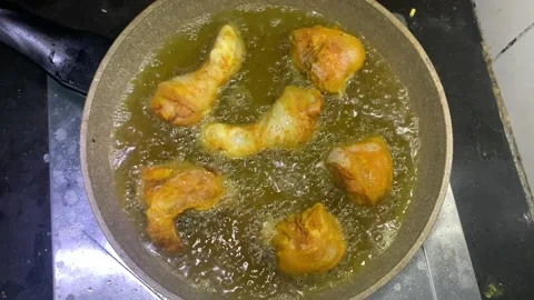 View of fried chicken being cooked in a pan, Stock Footage 285834670