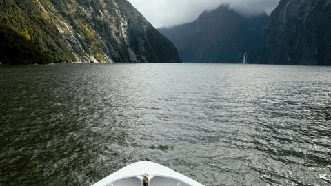 View from front of boat sailing through Milford Sound Stock Footage 90365372