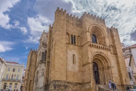 View of front facade of the gothic building of Coimbra Cathedral Stock Photos