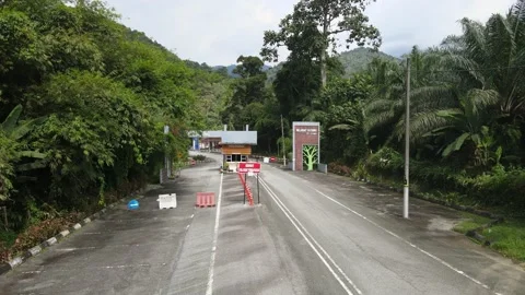 View of front gate at Lata Kinjang which were empty during MCO Stock Footage 149210294