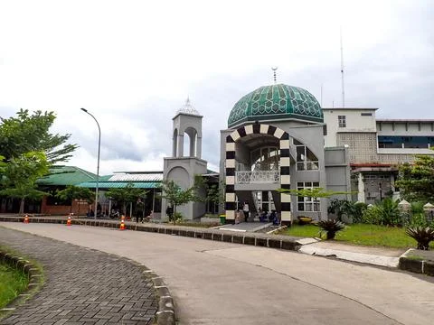 View from the front of the mosque building with a green dome Stock Photos