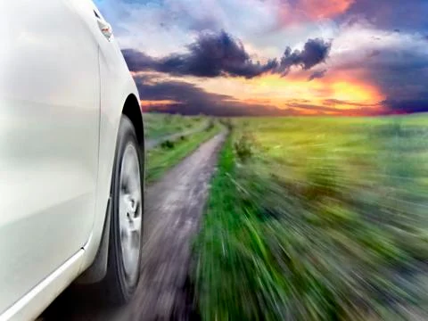 View of the front of a silver car while driving fast Stock-Fotos