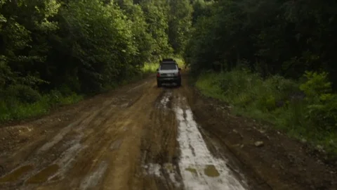 View from a front window of a cross over going across country through the forest Video stock 89022416