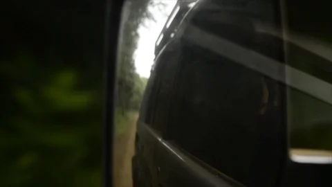 View from a front window of a cross over going across country through the forest 動画素材 89022426