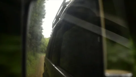 View from a front window of a cross over going across country through the forest 動画素材 89023063