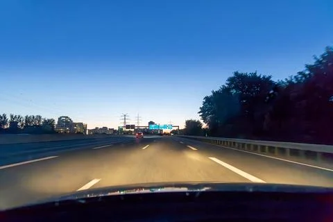 View from the front windshield of a car to the highway by night Stock Photos