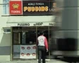 View of front of 'world famous pudding' shop SD Footage