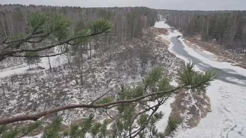 View of the frozen river in the forest from the observation deck in winter. Stock Footage 169693454