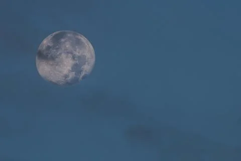 View of the full moon over blue sky Stock Photos