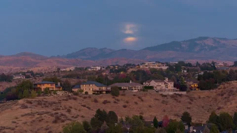 View of full moon over residential hills, United States. Video stock 344411853