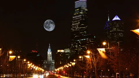 View of full moon rising over Philadelphia, United States at night, exclusive Video stock 171417114