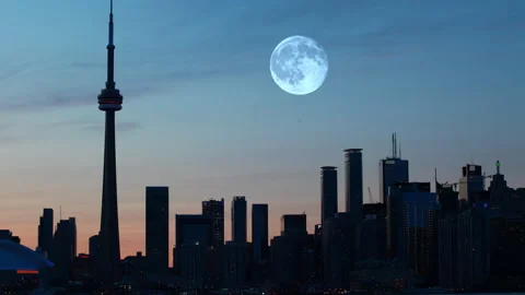 View of full moon rising over the city of Toronto, Ontario, Canada, exclusive Stock Footage 171418752