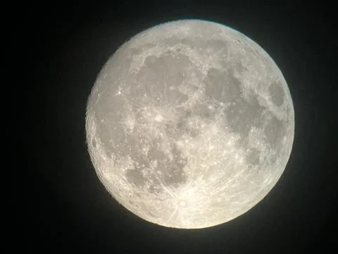 View of the full moon through a telescope on the eve of the supermoon and the 스톡 사진