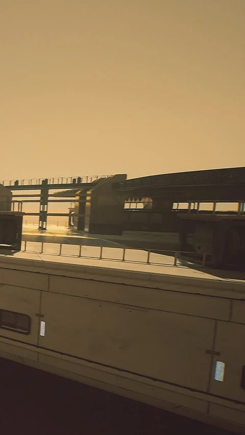 View of a futuristic building structure in a desert area during sunset Stock Footage 332214920
