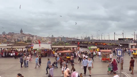 View of Galata Bridge and a square full of people and food stalls in Istanbul. Stock-Footage 150864498